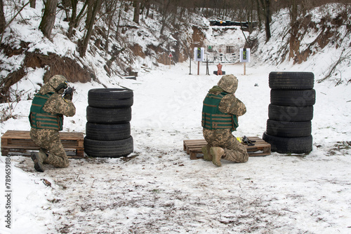 A Ukrainian soldiers trains in shooting photo