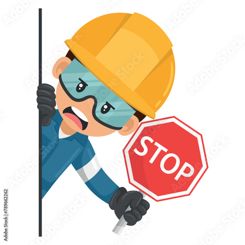 Annoyed industrial mechanical worker peeking out from behind a wall holding stop sign. Construction worker with his personal protective equipment. Industrial safety and occupational health at work