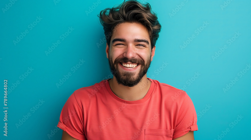 Joyful Young Hispanic Man with a Beard, Casual Red Tee, Exuberant Smile Joyful Young Hispanic Man with a Beard, Casual Red Tee, Exuberant Smile