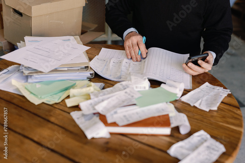 Senior Businessman Working Through Financials
 photo