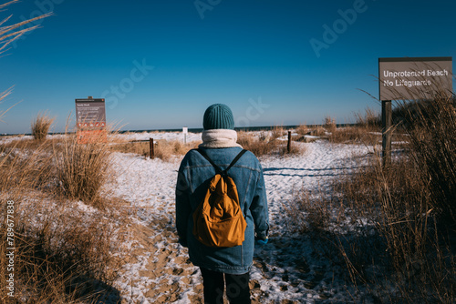 Visitor at Snowy Beach Entrance