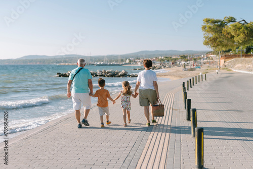 grandparents on a walk with their grandchildren  photo