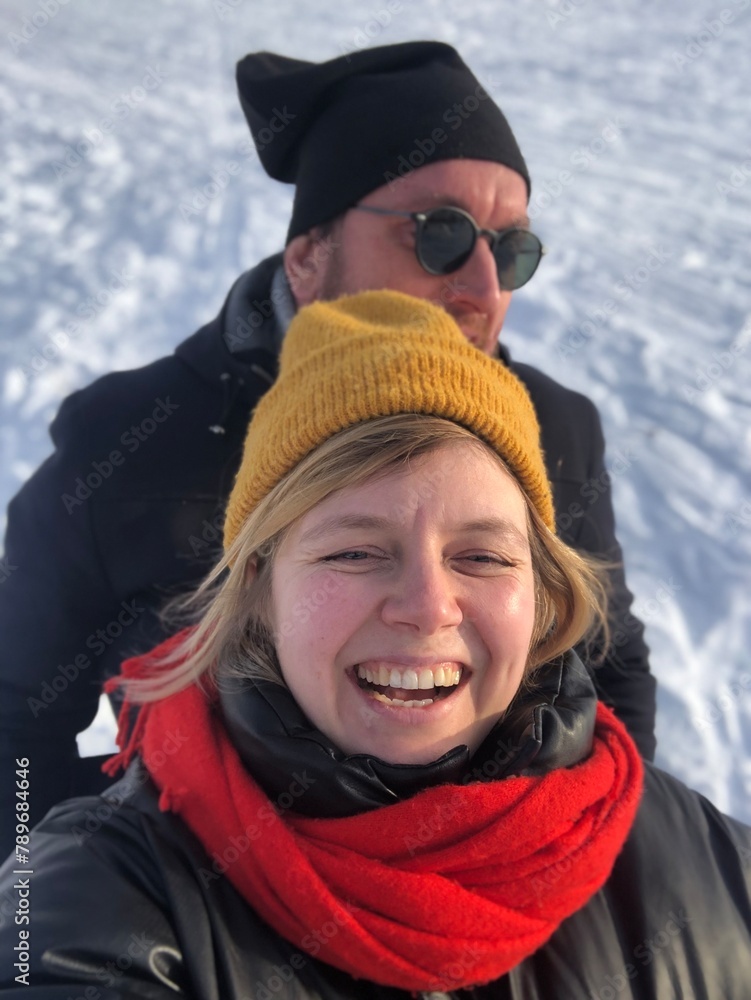 A smiling family having fun on a snow A smiling family having fun on a snow