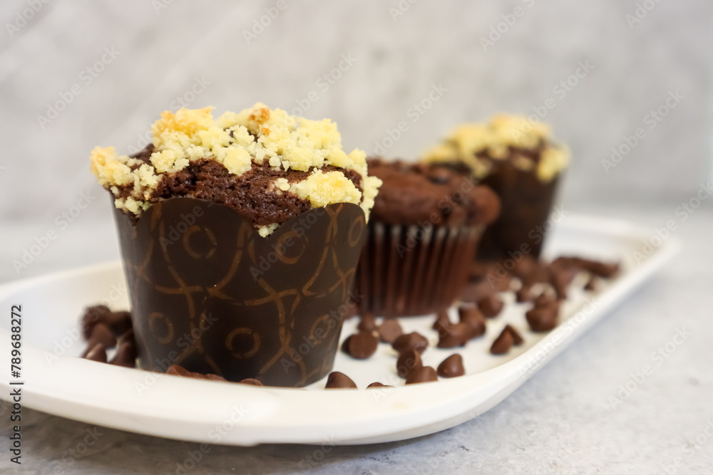 Chocolate muffin or cupcake with crumble topping Chocolate muffin or cupcake with crumble topping