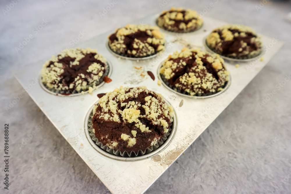 Chocolate muffin or cupcake with crumble topping Chocolate muffin or cupcake with crumble topping