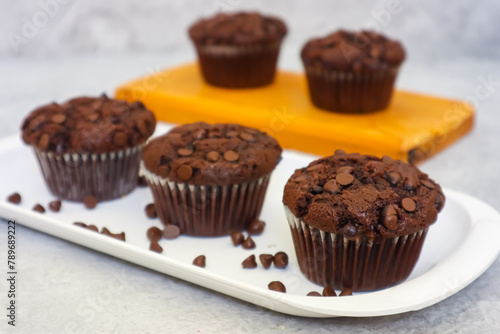 Chocolate muffin or cupcake with chocochips topping