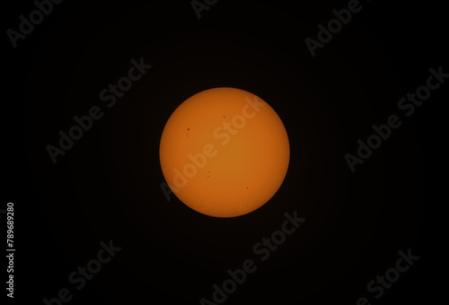 The Sun in visible light with sunspot, April 2024. During solar maximum, large numbers of sunspots appear	
