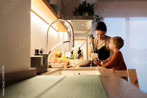 Happy family cooking together photo