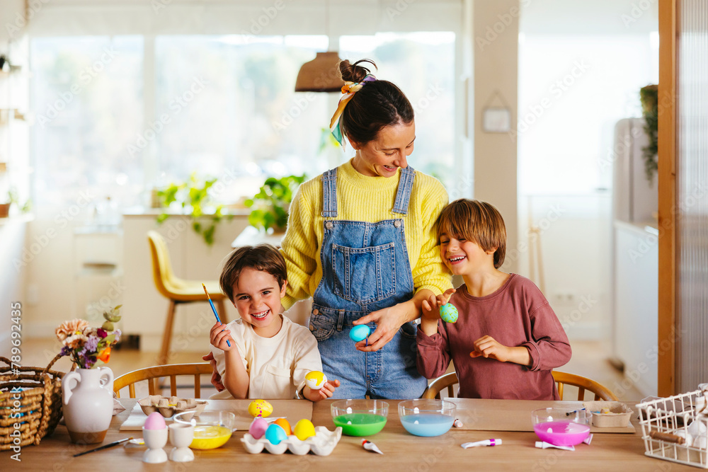 Family preparing eggs for Easter at home Family preparing eggs for Easter at home