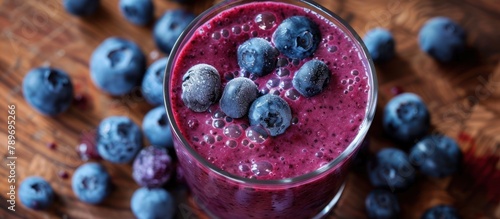 Glass of Blueberry Smoothie With Scattered Blueberries