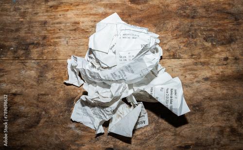 Paper Ball With Invoices On A Desk. photo