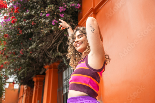 Happy Curly Hair Woman in the Street photo