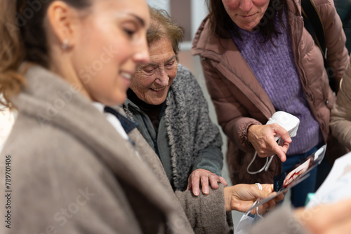 Mother sharing the results of an ultrasound scan with her family photo