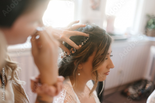 A bride having her hair done photo