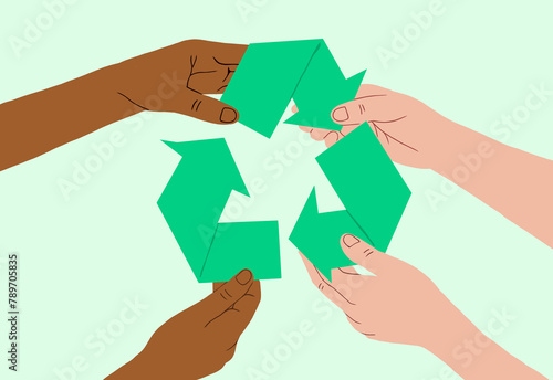 hands from diverse backgrounds join in holding recycling symbol photo