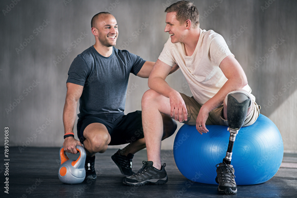 Obraz premium Physiotherapy, kettlebell and man with disability for training, fitness and muscle strength with coach for support. Amputee, exercise ball and physiotherapist for physical rehabilitation with workout