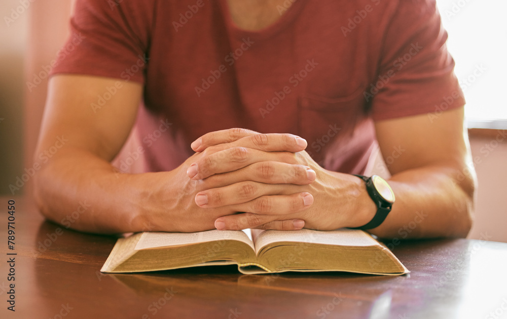 Faith, praying and hands with man, bible and spiritual with religion or worship with guidance or scripture. Closeup, guy in home or peace with person or holy book with trust or gratitude with believe Faith, praying and hands with man, bible and spiritual with religion or worship with guidance or scripture. Closeup, guy in home or peace with person or holy book with trust or gratitude with believe