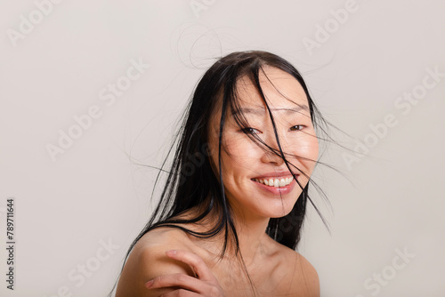 Woman with natural make up posing on white background in studio  photo
