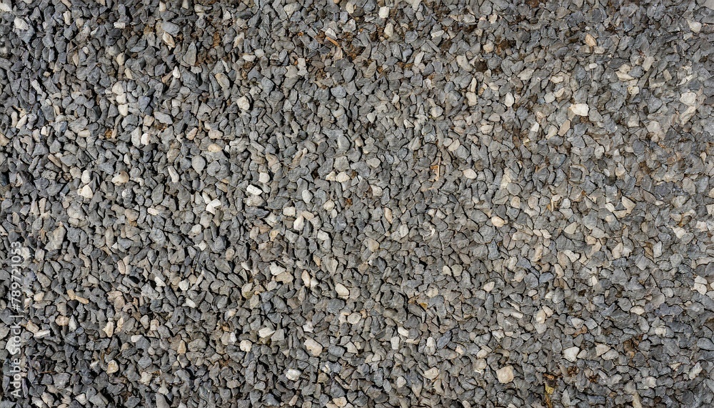 Top down view of a surface covered in gravel stones