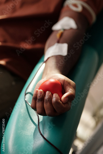 Unrecognizable Donor Squeezing Stress Toy photo