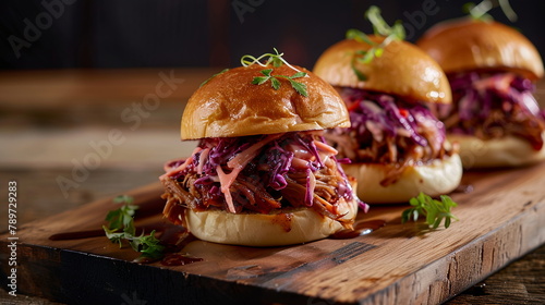 BBQ pulled pork sliders with tangy coleslaw on mini brioche buns.