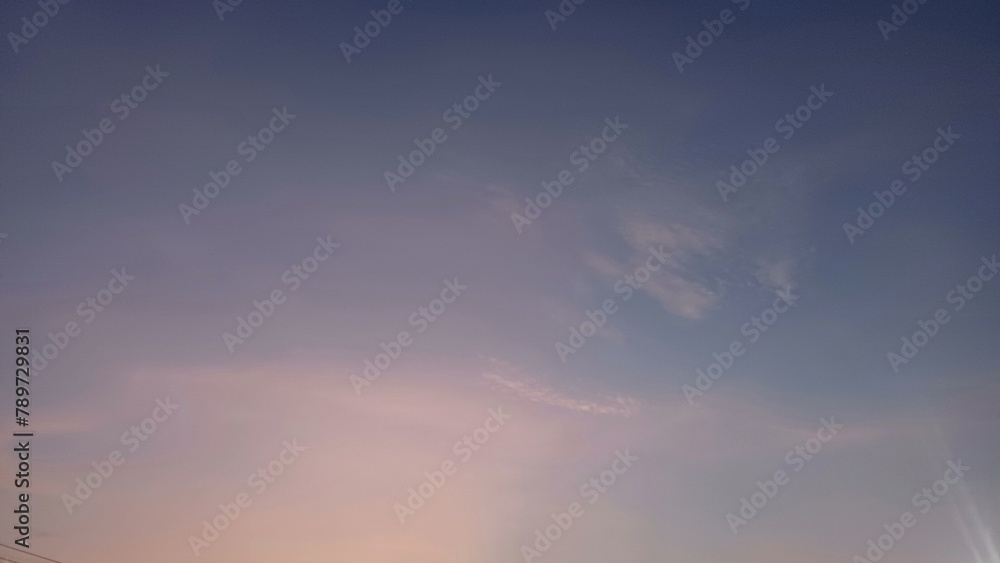 White Clouds Decorate the Beautiful Sunrise Sky as a Background Photo White Clouds Decorate the Beautiful Sunrise Sky as a Background Photo