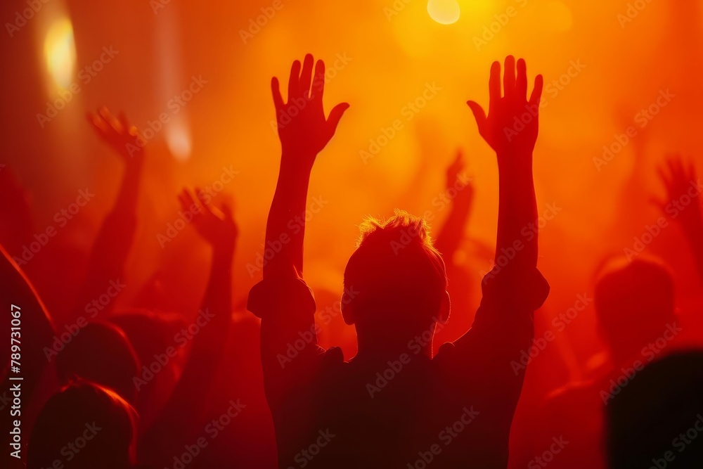 soft focus of christian worshipper with raised hands spiritual concept