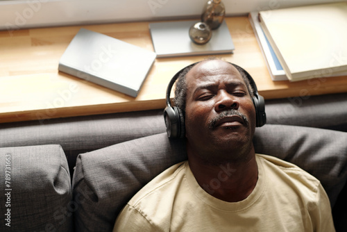 Senior Black Man Listening To Music photo