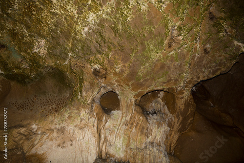 Speleology. The Bacho Kiro cave, Dryanovo, Bulgaria. Stalactite, and stalagmite speleothem formations. photo