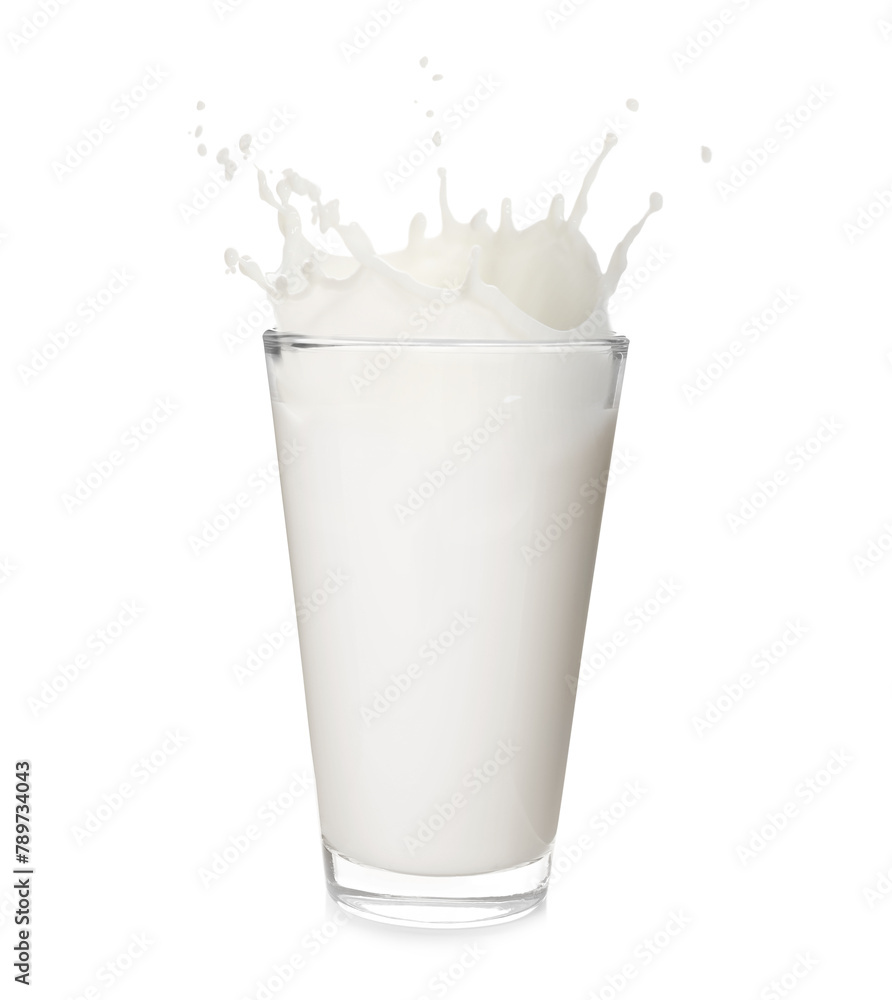 Milk splashing out of glass isolated on white Milk splashing out of glass isolated on white