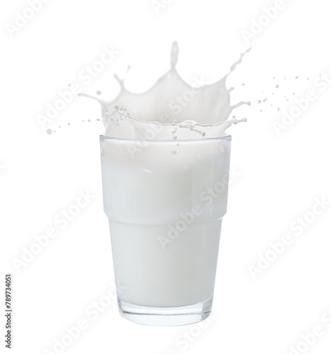 Milk splashing out of glass isolated on white