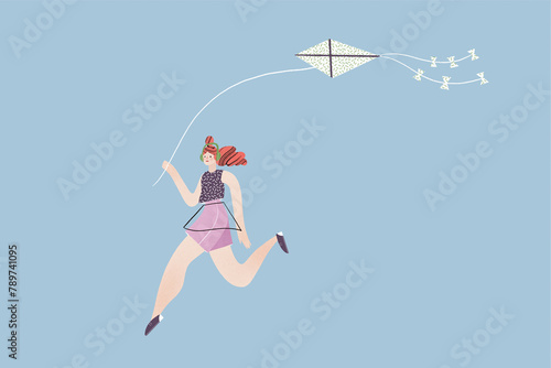 Careless female in headphones running with flying kite in hand photo
