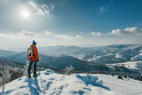 young man enjoying winter sports in snowy mountain landscape adventure and outdoor activities panoramic view