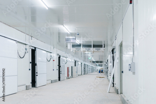 Illuminated warehouse white walls and doors photo