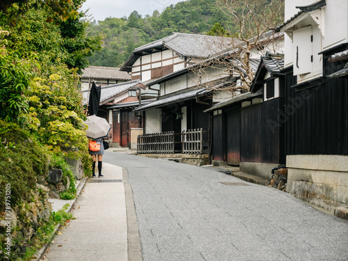 Street with old wooden houses in a neighborhood of japanese town photo