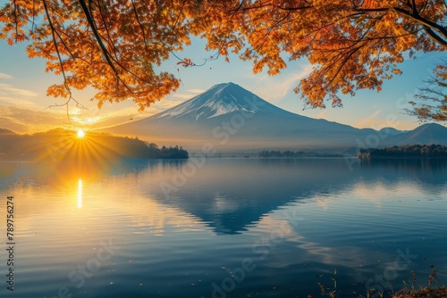 The early morning sun casts a golden glow over Lake Kawaguchiko, framing Mount Fuji's iconic peak. A luxurious travel snapshot capturing nature's grandeur.