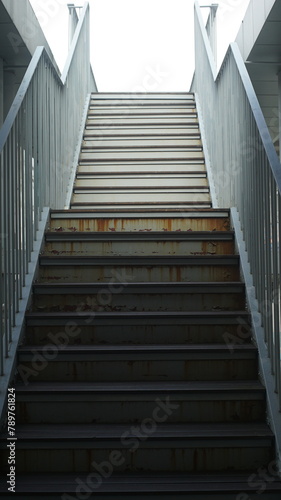 Rusty and peeled old metal staircase