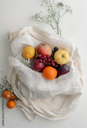 **a white cloth bag filled with fruit on a white background,with flowers in the style of infinity nets, uhd image, pentax k1000  photo