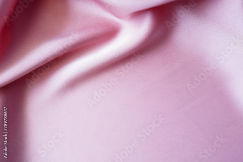 Textured Satin Duchess pink plush draping fabric. Elegant and elegant background. Space for web banner design templates. Close-up, blurred or blurred images. photo