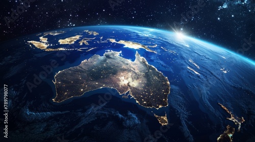 A photo of the Earth from space at night, showing the lights of Australia and the surrounding region.