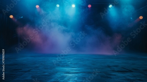 An empty stage with blue and purple lights and smoke photo