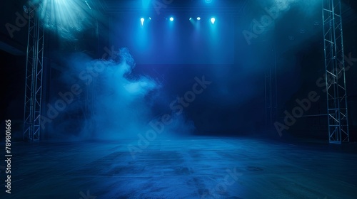 An empty stage with blue lights and smoke