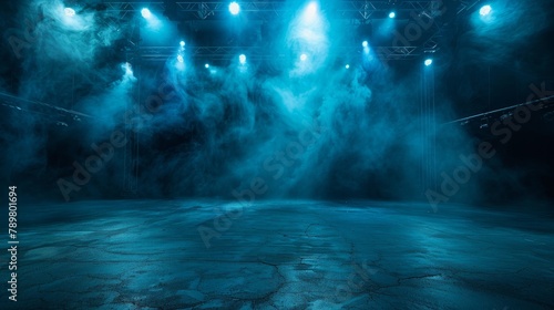 An empty theater stage with blue lights and smoke photo