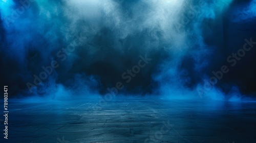 Blue smoke fills a dark room with spotlights in the background. photo