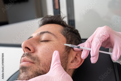 Close Up: Doctor Administering Botox, Applying Wrinkle Treatment on Male Patient for Skin Care and Beauty