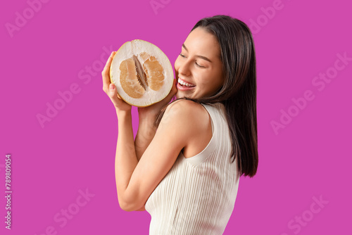 Smiling young woman with ha...