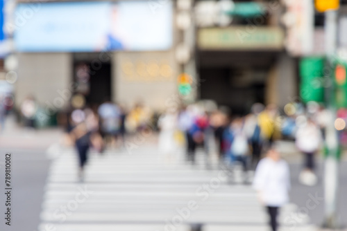 Blur view of the people cross the road in city © leungchopan