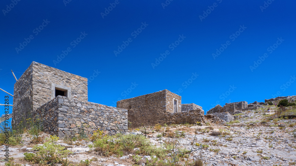 Ruin of old windmills on the hilltop (Lasithi Plateau, Crete, Greece)