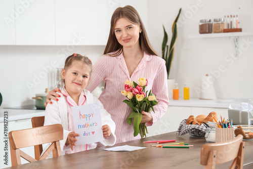 Cute daughter greeting her ...