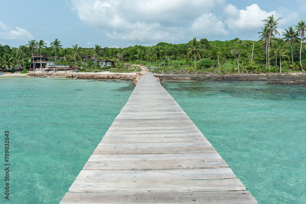 Wooden bridge on sea for entry to the beautiful island.